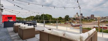 Rooftop amenity deck with a downtown view